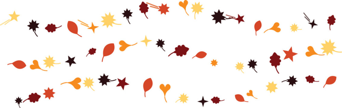 Autumn confetti scattered across white backdrop with falling leaves and star shapes during golden hour