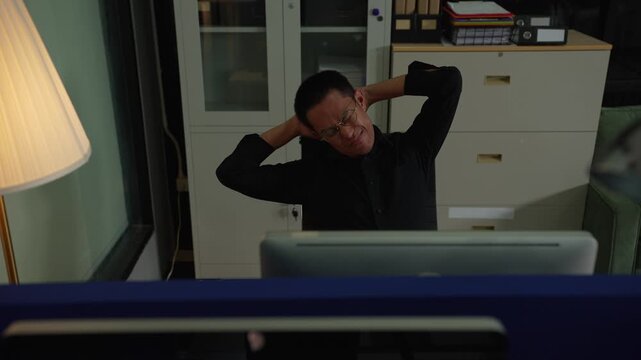 Male businessman is doing a stretchy posture due to sitting in the office for too long, office syndrome concept.