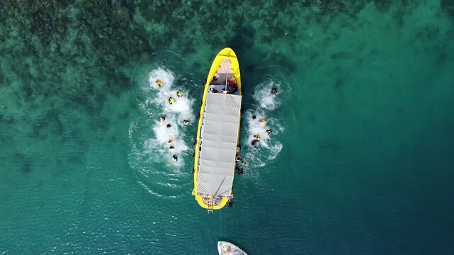 People jumped off the boat to swim and snorkel in the sea.