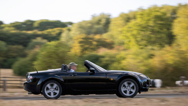 Milton Keynes,UK - Aug 22nd 2026: 2007 Mazda MX5 convertiblecar driving on a British road