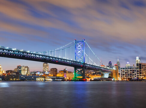Philadelphia, Pennsylvania, USA skyline on the Delaware river with Ben Franklin Bridge at dusk 206