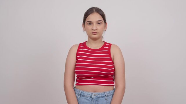 Indian Teenage Girl Looking in Camera with Poker Face