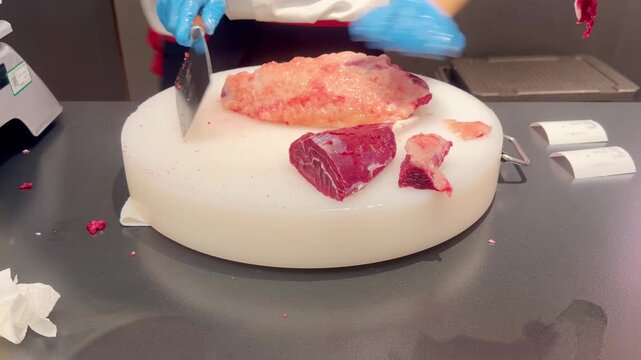 Chef Hands Thinly Slicing Marbled Beef and Plating for Hot Pot &ndash; Preparing Premium Meat 
