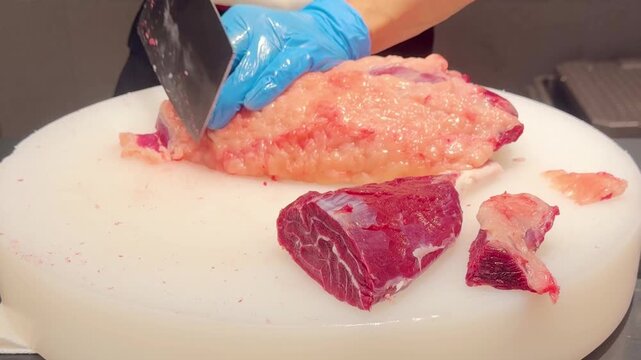 Chef Hands Thinly Slicing Marbled Beef and Plating for Hot Pot &ndash; Preparing Premium Meat 