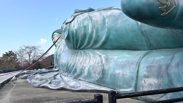 Close-up of bronze Buddha statue hand