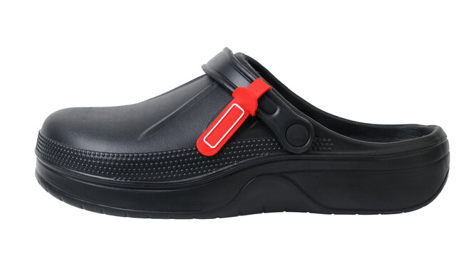 Black rubber clogs with strap isolated on white background.