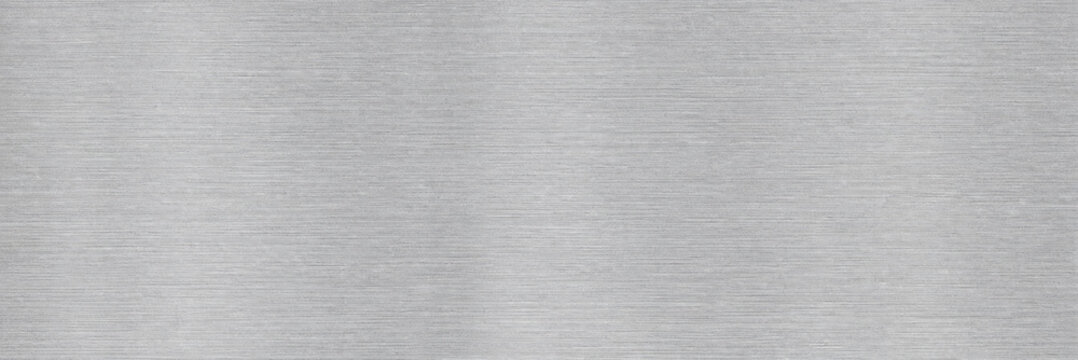 Brushed Aluminum Metal Sheet. Stainless Silver Steel Texture Background. Smooth Industrial Surface. Modern Minimalist Grunge Wallpaper. Technology And Engineering Layout Concept.