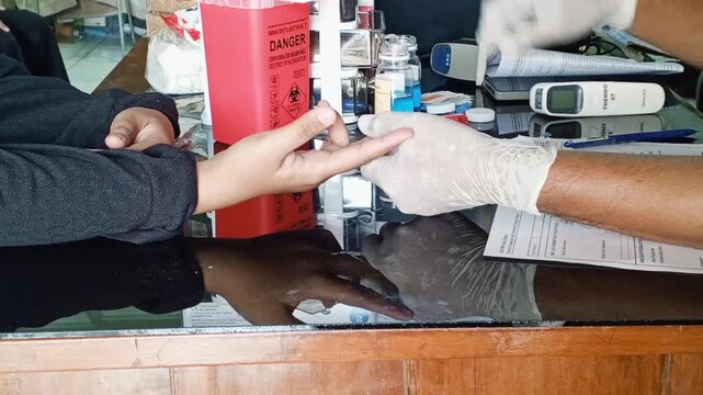 Collecting a capillary blood sample (fingerstick) from the fingertip using a lancet is the initial screening step for checking hemoglobin (Hb) levels and determining blood type prior to blood donation