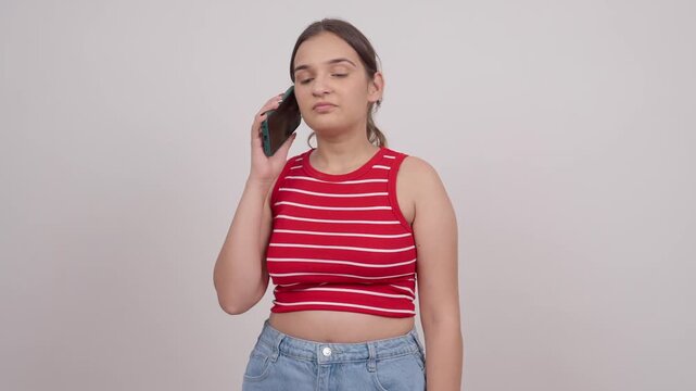 Happy Indian Teenage Girl Talking on Mobile Phone