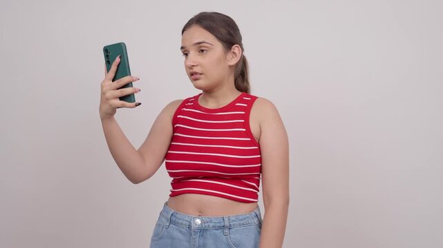 Sad Indian Teenage Girl Talking on Video Call
