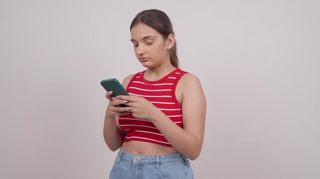 Indian Teenage Girl Texting on Mobile Phone
