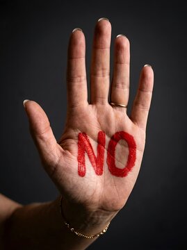 Open Palm with NO Message Representing Refusal and Personal Boundaries. Refusal, rejection, personal boundaries, consent, and assertive communication. Protection, prevention, disagreement, independent