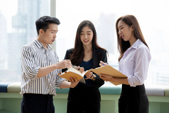 Asian Business Team Having a Professional Meeting and Discussing Ideas in a Modern Office