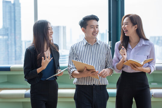 Asian Business Team Having a Professional Meeting and Discussing Ideas in a Modern Office