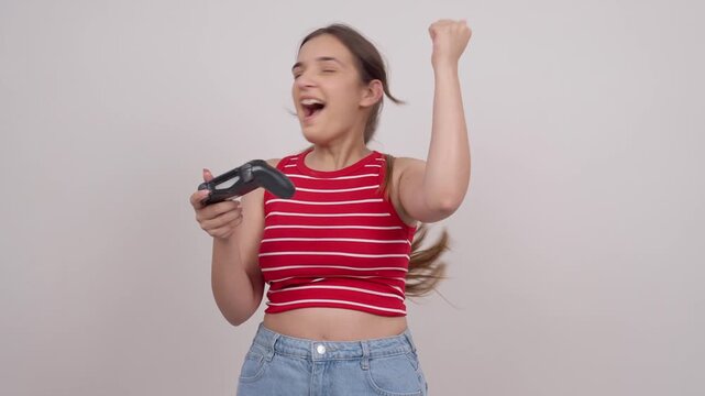 Indian Teenage Girl Playing Game with Controller Winning and Celebrating