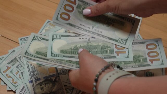 Money counting cash hands, counting pile of hundred dollar bills on table for financial transaction success and business banking wealth concept