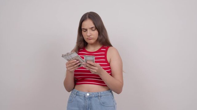 Confused Indian Teenage Girl Counting Money, Indian Rupees