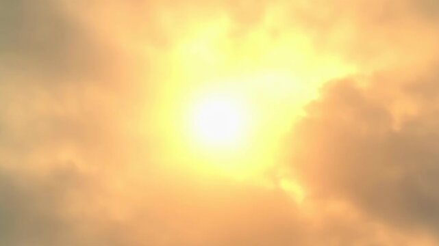 Sunlight Glowing Through Hazy Clouds Creating Warm Atmospheric Sky Glow and Soft Natural Lightscape