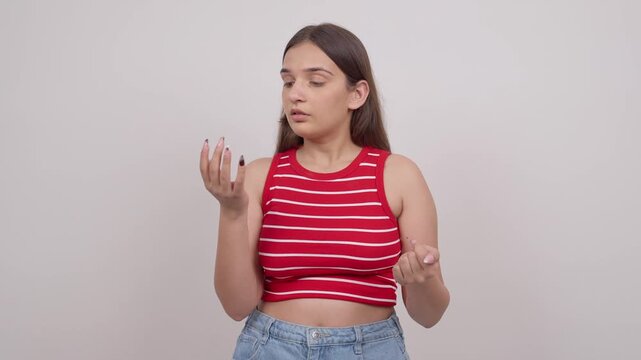 Confused Indian Teenage Girl Doing Calculations on Fingers