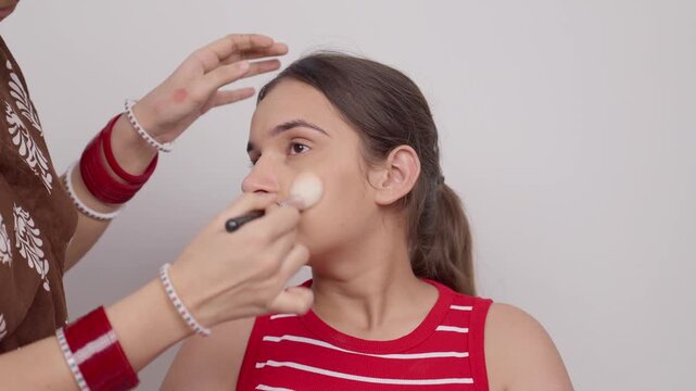 Makeup Artist Doing Makeup on Indian Teenage Girl 