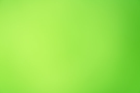 Abstract bright green and lime green blurred gradient background with soft light effect and copy space for eco-friendly design, organic food promo, bio products, spring concept, and seasonal marketing