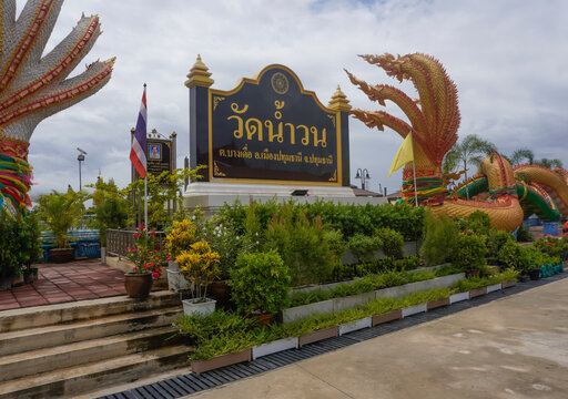 Pathum Thani, Thailand, August 29, 2026. Wat Nam Wan is a famous temple known for its traditional Mon-style bone-setting and herbal compress treatments. In front of the temple is a fish sanctuary wher