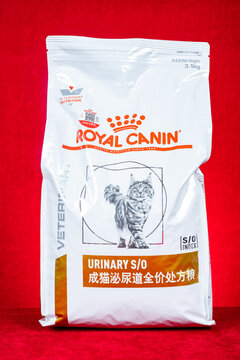 ZhongShan GuangDong China-August 27, 2026: Royal Canin Urinary S/O veterinary prescription cat food bag against red velvet background.