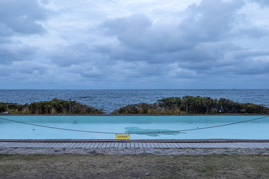Molle, Sweden An empty blue sea pool with a closed sign in Swedish