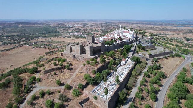 Scenic aerial view of the historic walled village of Monsaraz and its medieval castle, a prominent landmark in the Alentejo region, Portugal