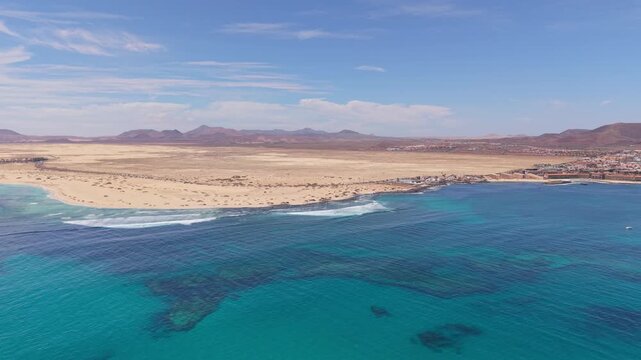 Aerial views of Corralejo town on the northeast coast of Fuerteventura, Canary Islands of Spain. It's known for Corralejo Natural Park, featuring windy, dune-backed beaches like Playa del Moro.