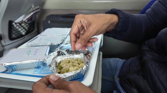 Passenger Opening Packaged Lunch Meal Inside Vande Bharat Train in India