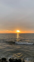Fototapeta premium Brilliant Golden Sunset Over the Sea