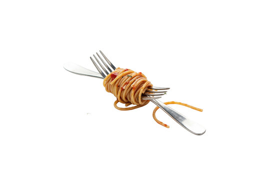 Twirled spaghetti pasta wrapped around a metal fork and knife on a white surface isolated on a transparent background