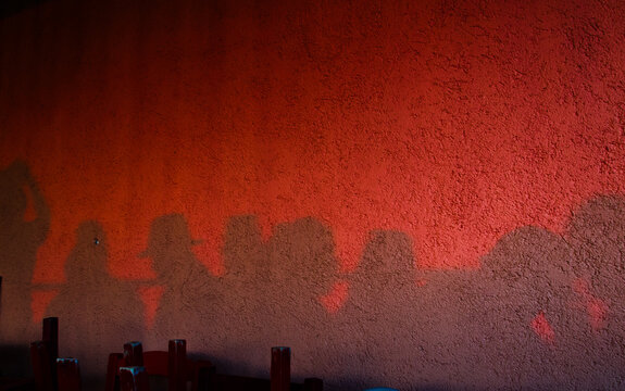 Strange shadows on the wall of a greek taverna maybe ghosts of past customers