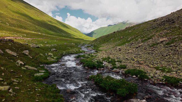 Aerial Forward Movement Over Rushing Mountain River