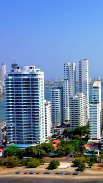 Aerial view of modern high rise apartment buildings and hotels along the coastline in Cartagena, Colombia