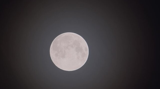 Full moon - super moon moves through the night sky.
