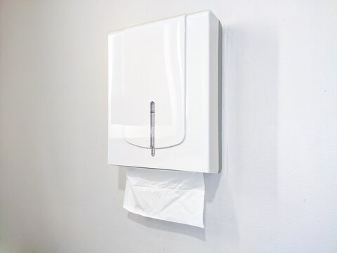 Minimalist white wall-mounted tissue box in a clean interior, offering practical hygiene access with a sleek design that blends seamlessly into modern bathroom or office spaces.