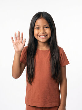 Young girl waving hello with a smile on a white background