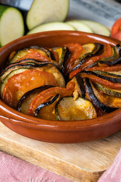 Rustic baked vegetable ratatouille in terracotta dish