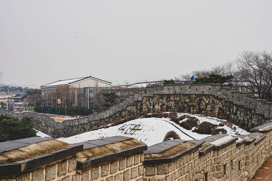 Historic Korean fortress wall in winter landscape