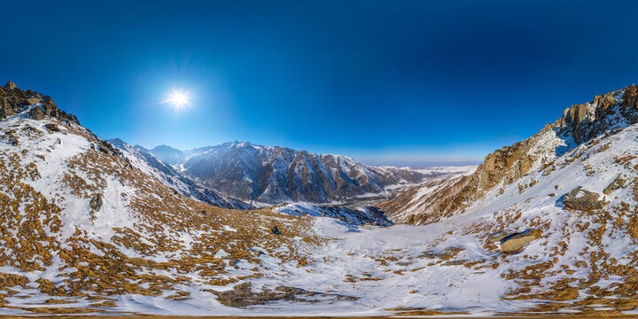 Snow-Dusted Mountain Valley Panorama in Kyrgyzstan