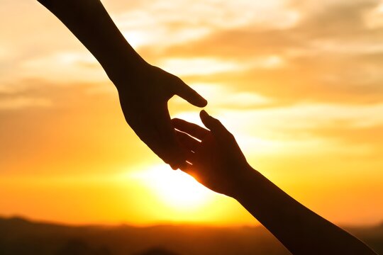 Helping Hands Reaching Out at Sunset