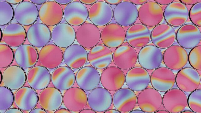 Iridescent circles create a mesmerizing abstract pattern. Seamlessly looped candy glass bubbles with bright, colorful gradients offer a modern, clean, and inspiring background animation.