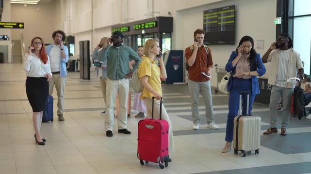 Diverse group of people talking on smartphones at the airport