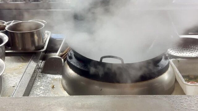 Hands Cooking Noodles and Vegetables in Wok &ndash; Chinese Restaurant Kitchen