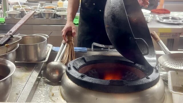 Hands Cooking Noodles and Vegetables in Wok &ndash; Chinese Restaurant Kitchen