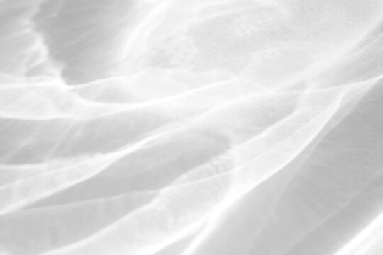 Real billowing water caustic shadow cut out on a transparent png background with soft diffused edges. Anchors a soft luxury fashion overlay, high-end fashion and luxury cosmetic design as.