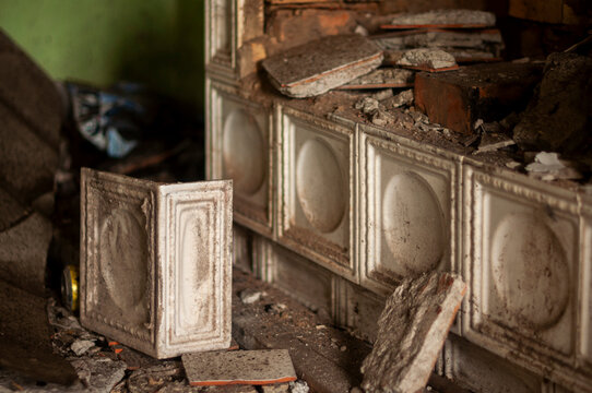Abandoned overgrown mansion with spiral staircase, old car and ruined interior