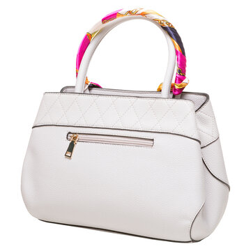 White leather womens handbag with colorful silk scarf on handle isolated on white background. Elegant quilted purse